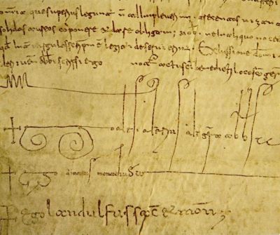Dettaglio di un documento medievale con testo latino e la firma autografa dell’abate Desiderio.